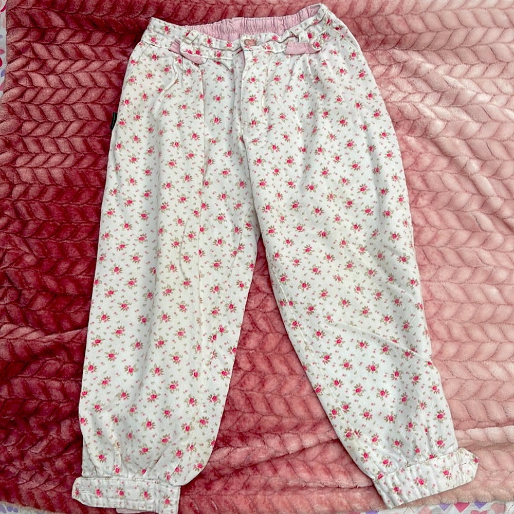 Girls light cord bombacha style pants. Button close and button at ankles.